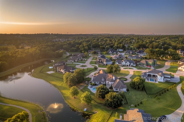 aerial view at dusk with a water view