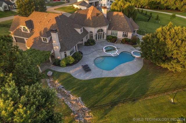3520 W 77th St S, Tulsa, OK 74132 - view of swimming pool with a patio, a lawn, and a pool with connected hot tub