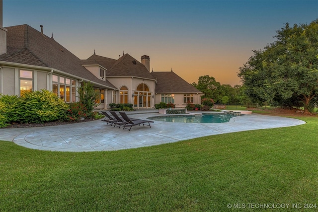3520 W 77th St S, Tulsa, OK 74132 - view of swimming pool featuring a patio, a yard, and a pool with connected hot tub