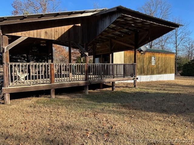 exterior space featuring a lawn and a wooden deck