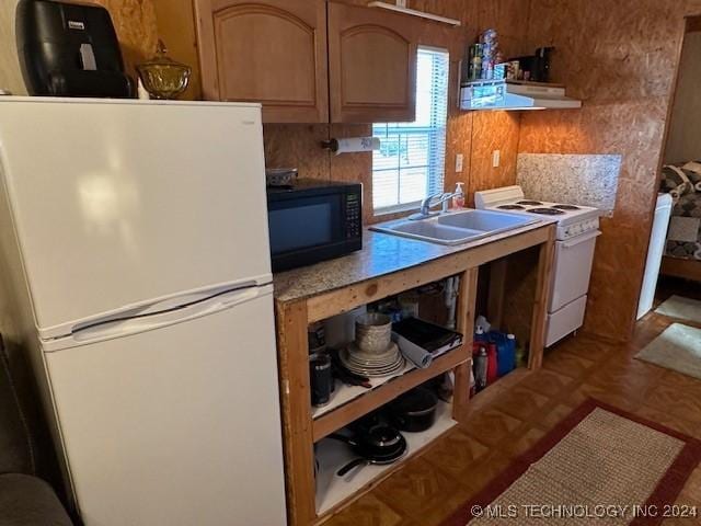 kitchen with sink and white appliances