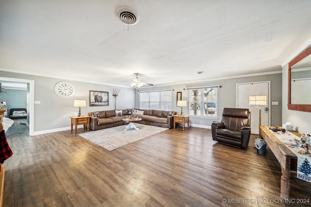 living room featuring dark hardwood / wood-style floors, ceiling fan, and ornamental molding