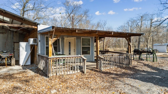 view of front of house featuring a wall mounted air conditioner