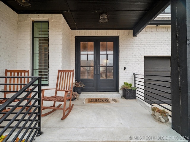 entrance to property featuring french doors