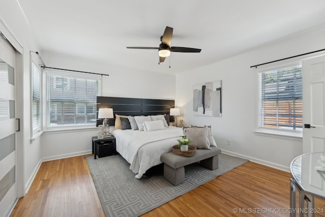 bedroom featuring ceiling fan and hardwood / wood-style floors