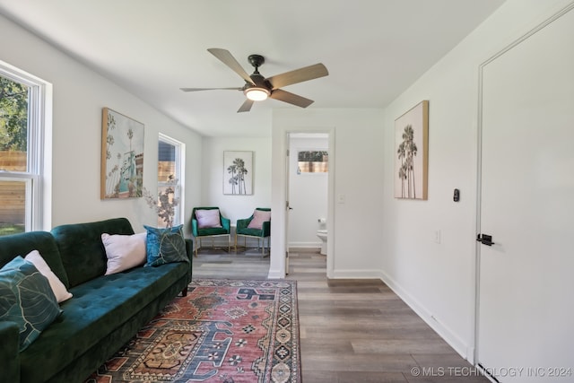 living room with ceiling fan and hardwood / wood-style floors