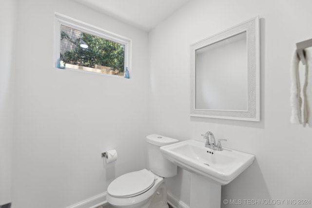 bathroom with toilet and sink