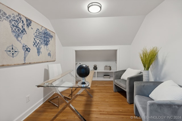 office space featuring wood-type flooring and lofted ceiling