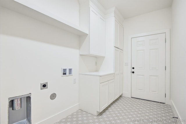 washroom with cabinets, hookup for a washing machine, and electric dryer hookup