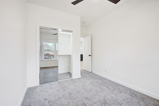 unfurnished bedroom with ceiling fan, a closet, and carpet floors