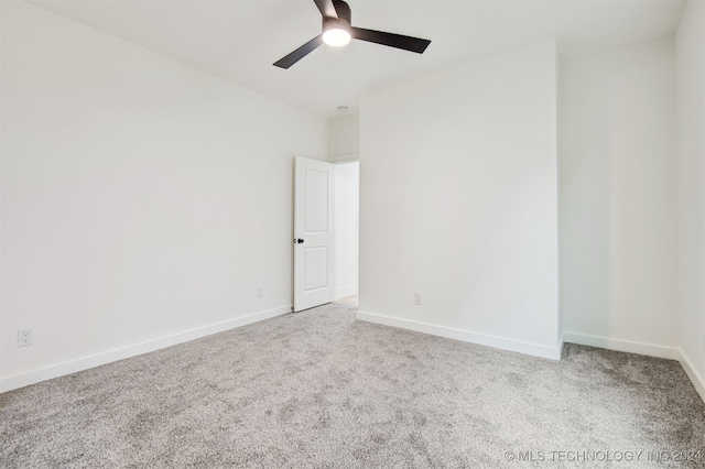 unfurnished room featuring ceiling fan and light colored carpet