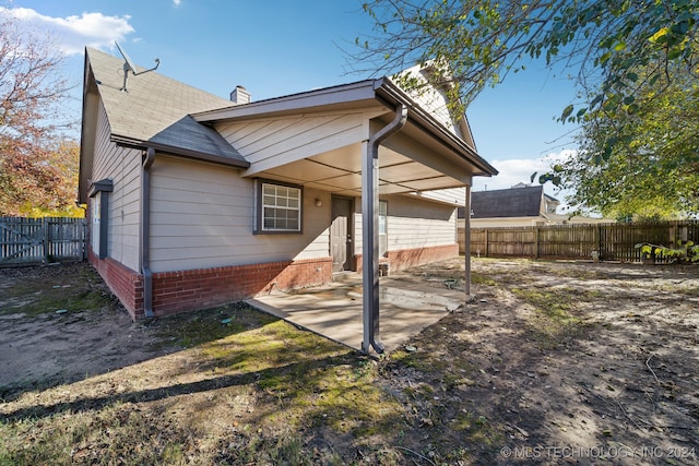 rear view of house with a patio