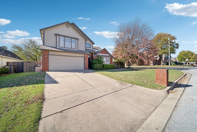 front of property with a garage, a front lawn, and cooling unit