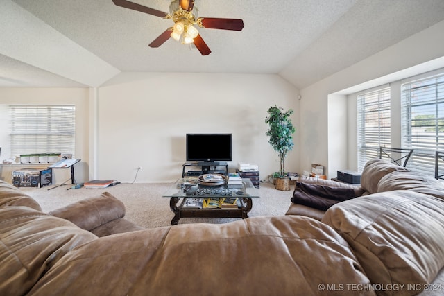 living room featuring carpet flooring, a textured ceiling, ceiling fan, and lofted ceiling