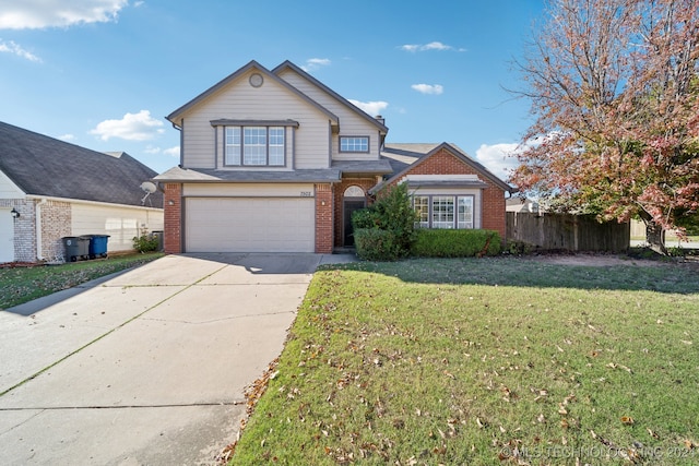 front facade featuring a front yard and a garage