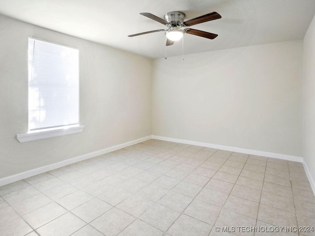 unfurnished room with light tile patterned floors and ceiling fan