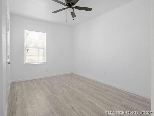 unfurnished room with light wood-type flooring and ceiling fan