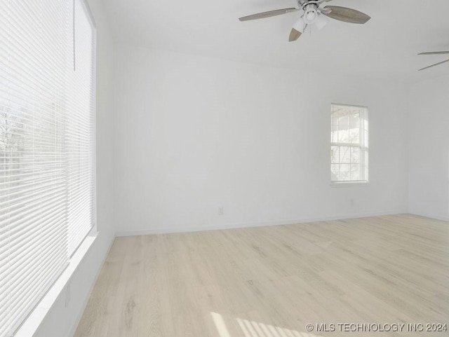 spare room with ceiling fan and light hardwood / wood-style floors