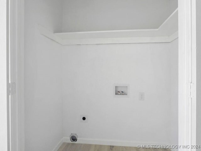 laundry area featuring washer hookup, hardwood / wood-style floors, and hookup for an electric dryer