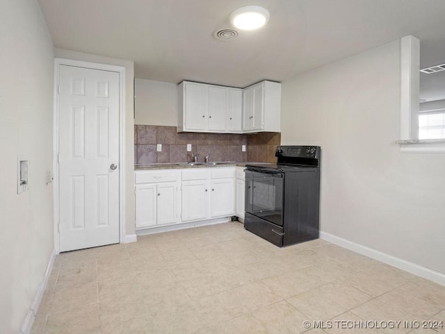 kitchen featuring white cabinetry, sink, backsplash, and black range with electric cooktop