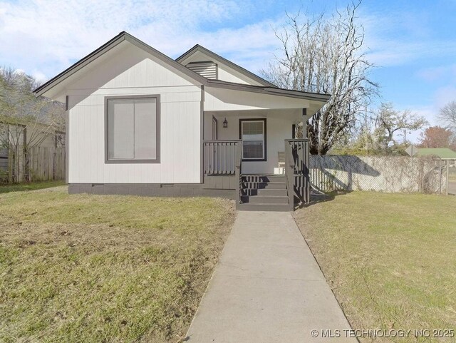 view of front facade with a porch and a front yard