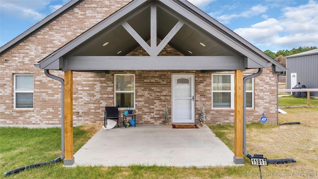 exterior space with a lawn and a patio area