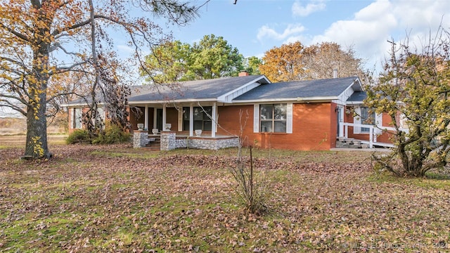 back of house with covered porch