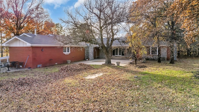 back of property featuring a patio