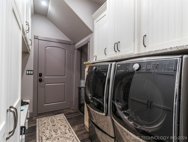 clothes washing area with cabinets, independent washer and dryer, and dark wood-type flooring