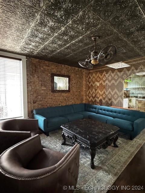 living room with brick wall