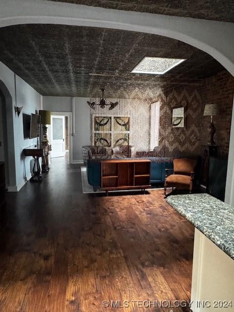 interior space with dark wood-type flooring