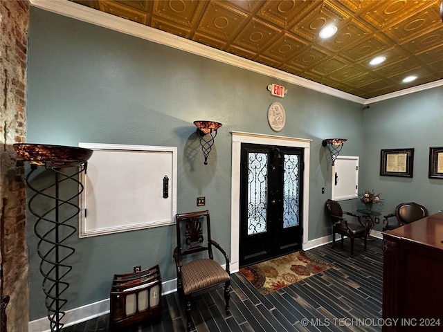 entryway featuring hardwood / wood-style flooring and crown molding