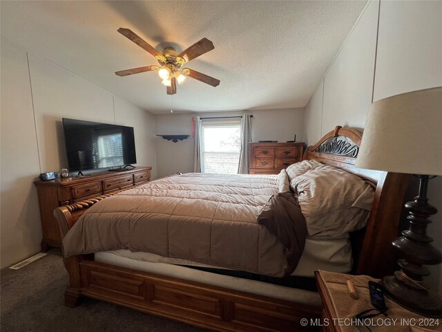 carpeted bedroom with ceiling fan, lofted ceiling, and a textured ceiling