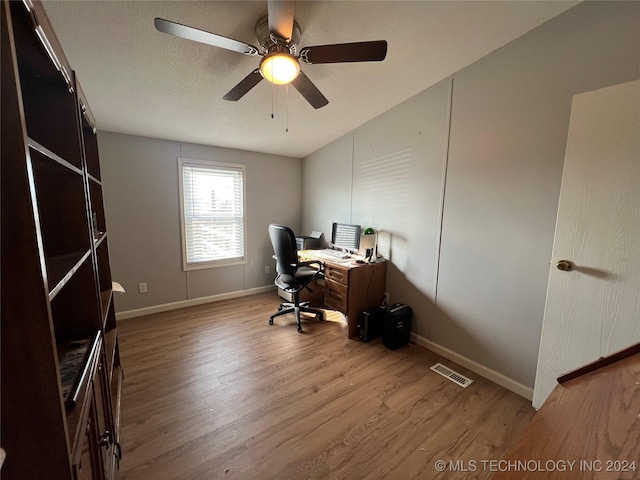 office area with wood-type flooring and ceiling fan