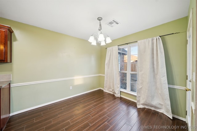 unfurnished dining area with a chandelier