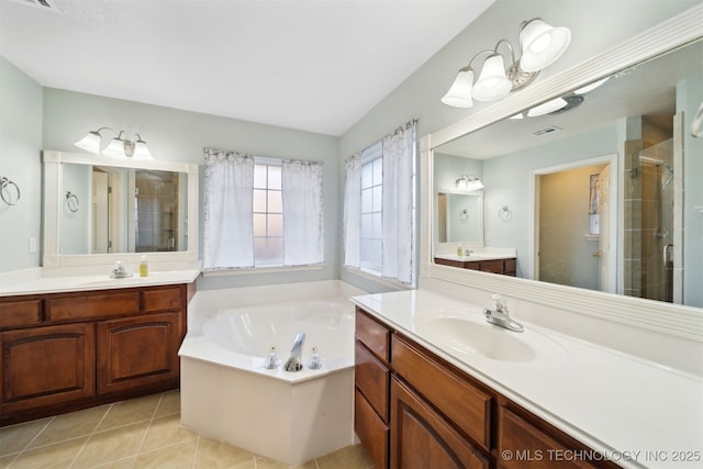 bathroom featuring tile patterned floors, shower with separate bathtub, and vanity