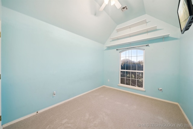 unfurnished room featuring carpet, lofted ceiling, and ceiling fan