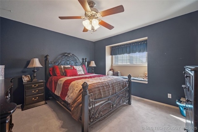 bedroom with ceiling fan and carpet