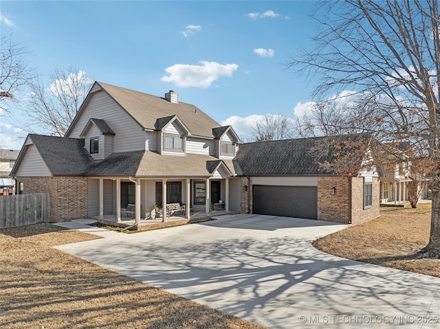 view of front of house with a porch and a garage