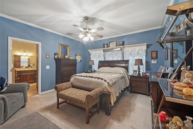 carpeted bedroom with ornamental molding, connected bathroom, and ceiling fan