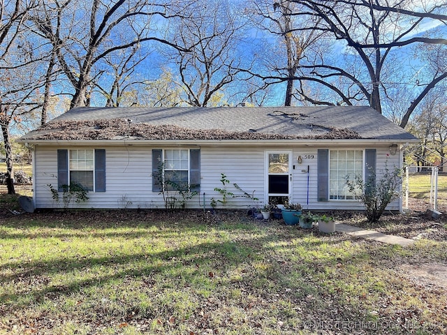 ranch-style home with a front yard