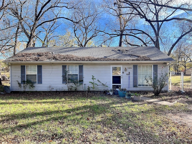 single story home with a front yard