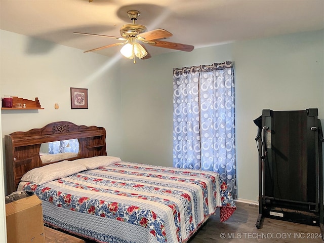 bedroom featuring ceiling fan and dark hardwood / wood-style flooring