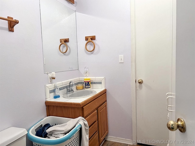 bathroom with vanity and toilet