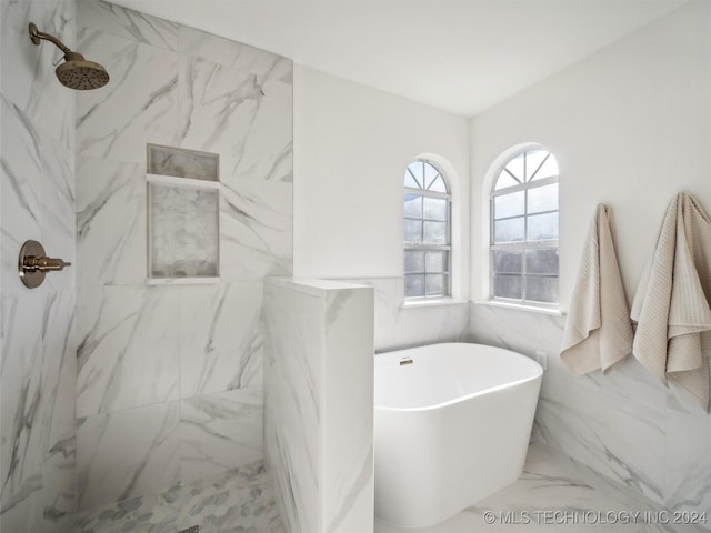 bathroom featuring plus walk in shower