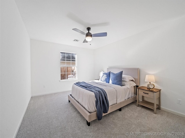 bedroom with light colored carpet and ceiling fan