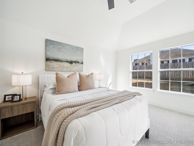 carpeted bedroom featuring ceiling fan and lofted ceiling