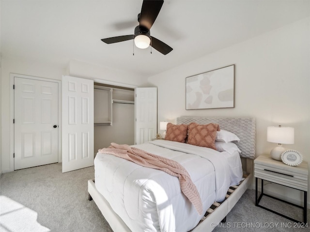 carpeted bedroom with a closet and ceiling fan