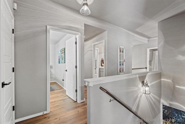 corridor featuring hardwood / wood-style floors