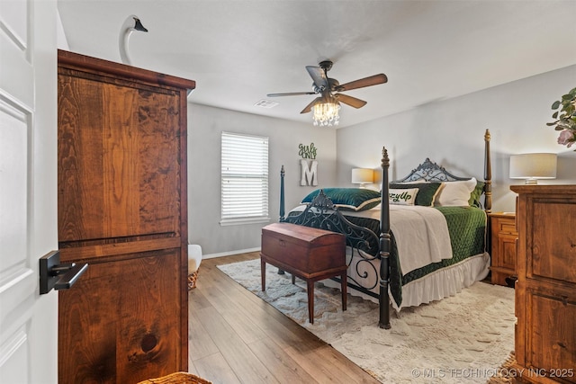 bedroom featuring ceiling fan and light wood-type flooring